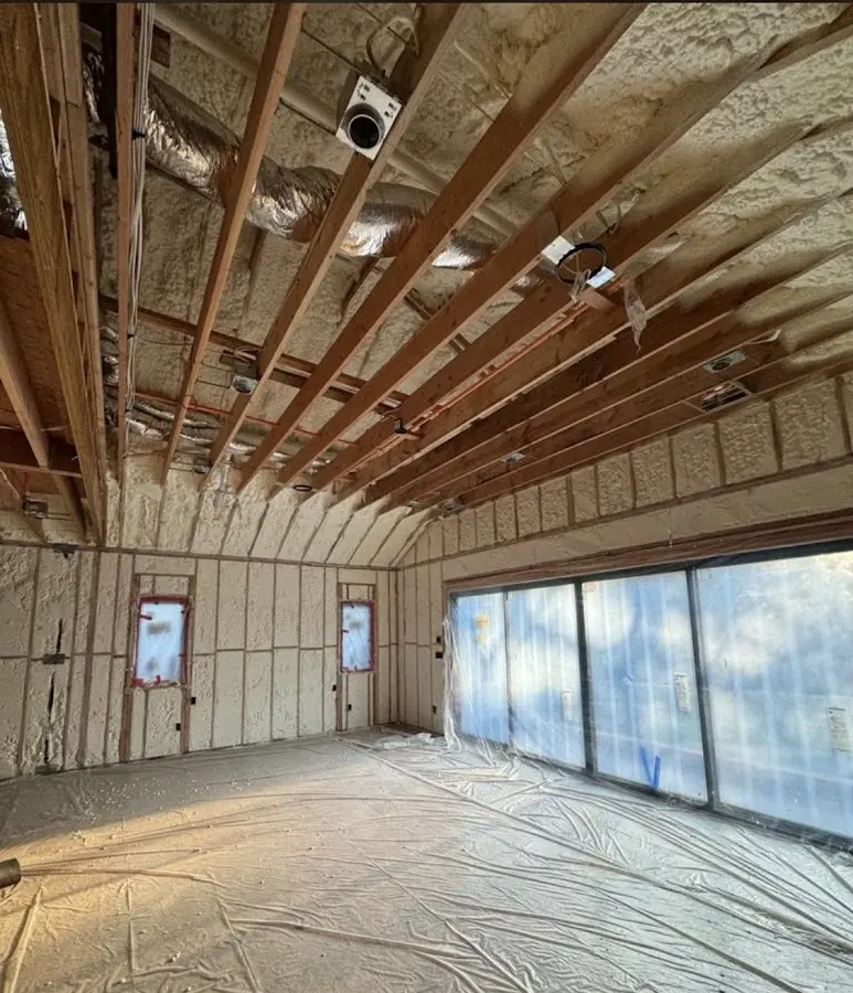 Interior walls and ceiling insulated with spray foam during new construction in West Earl
